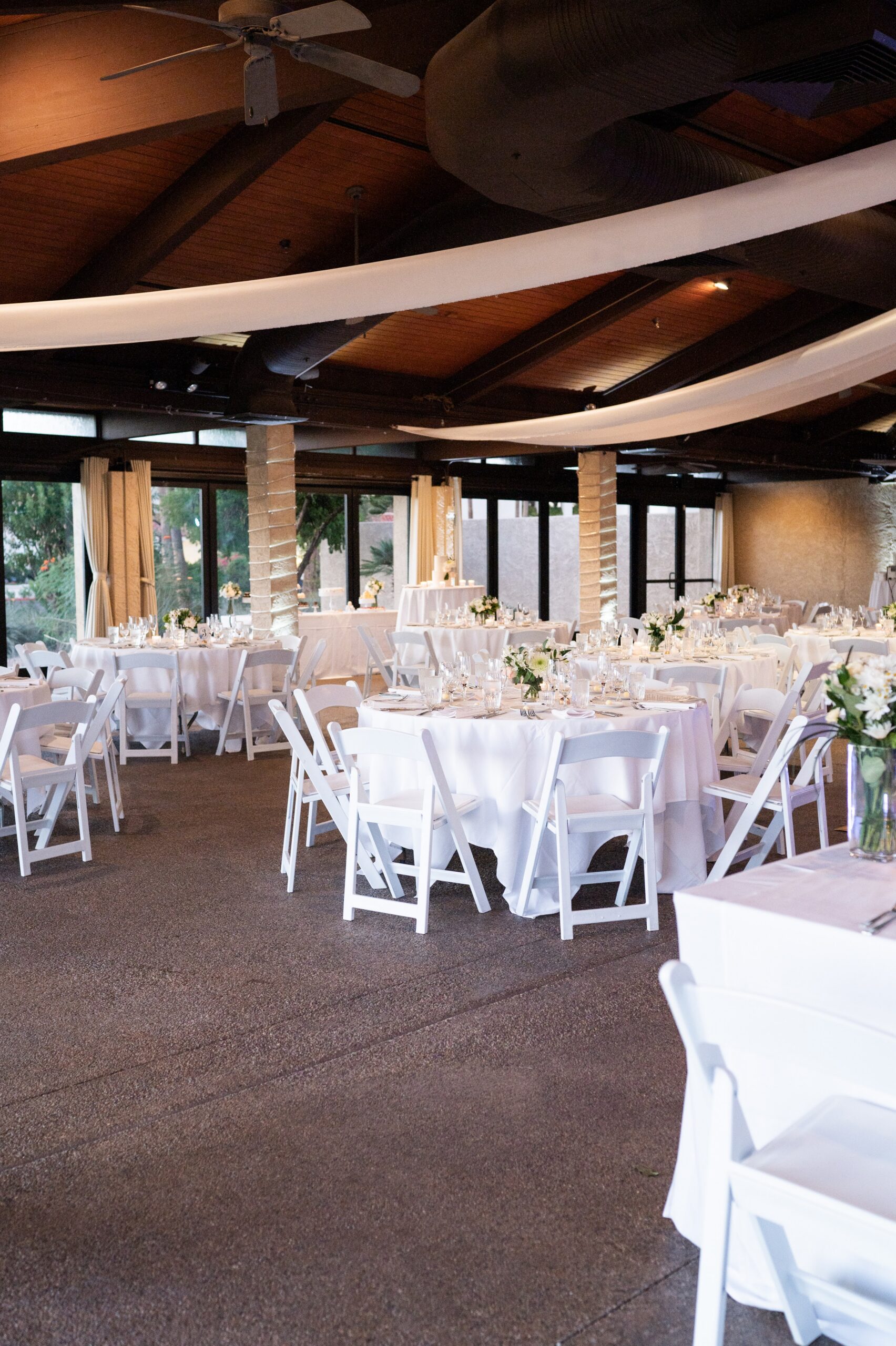 White dove remembrance pins displayed for wedding guests