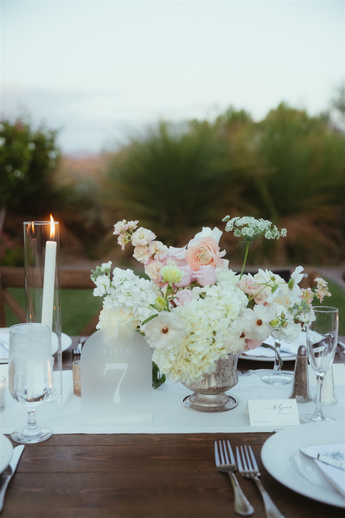Elegant reception tablescape with floral arrangements