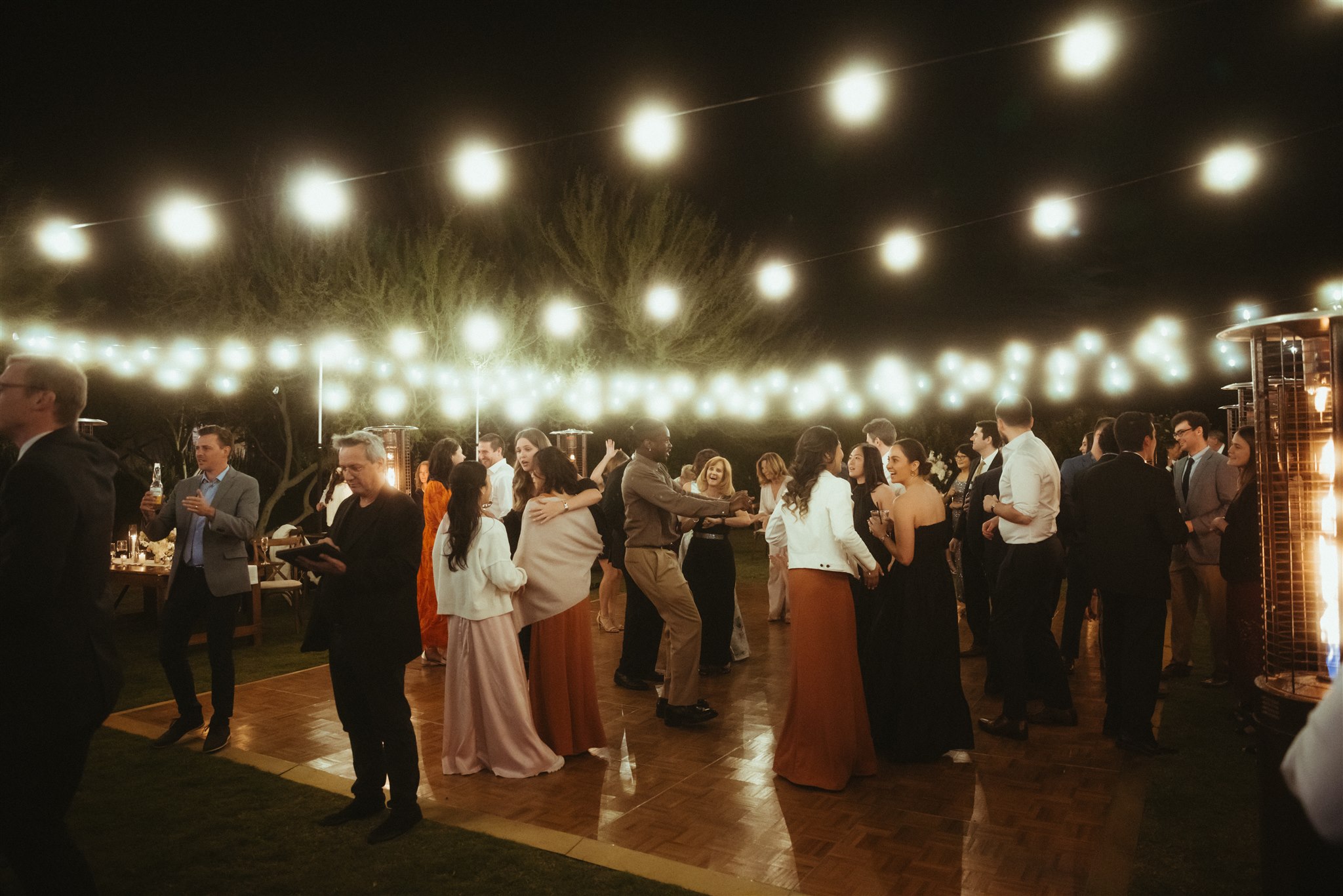 Guests dancing beneath the Arizona night sky